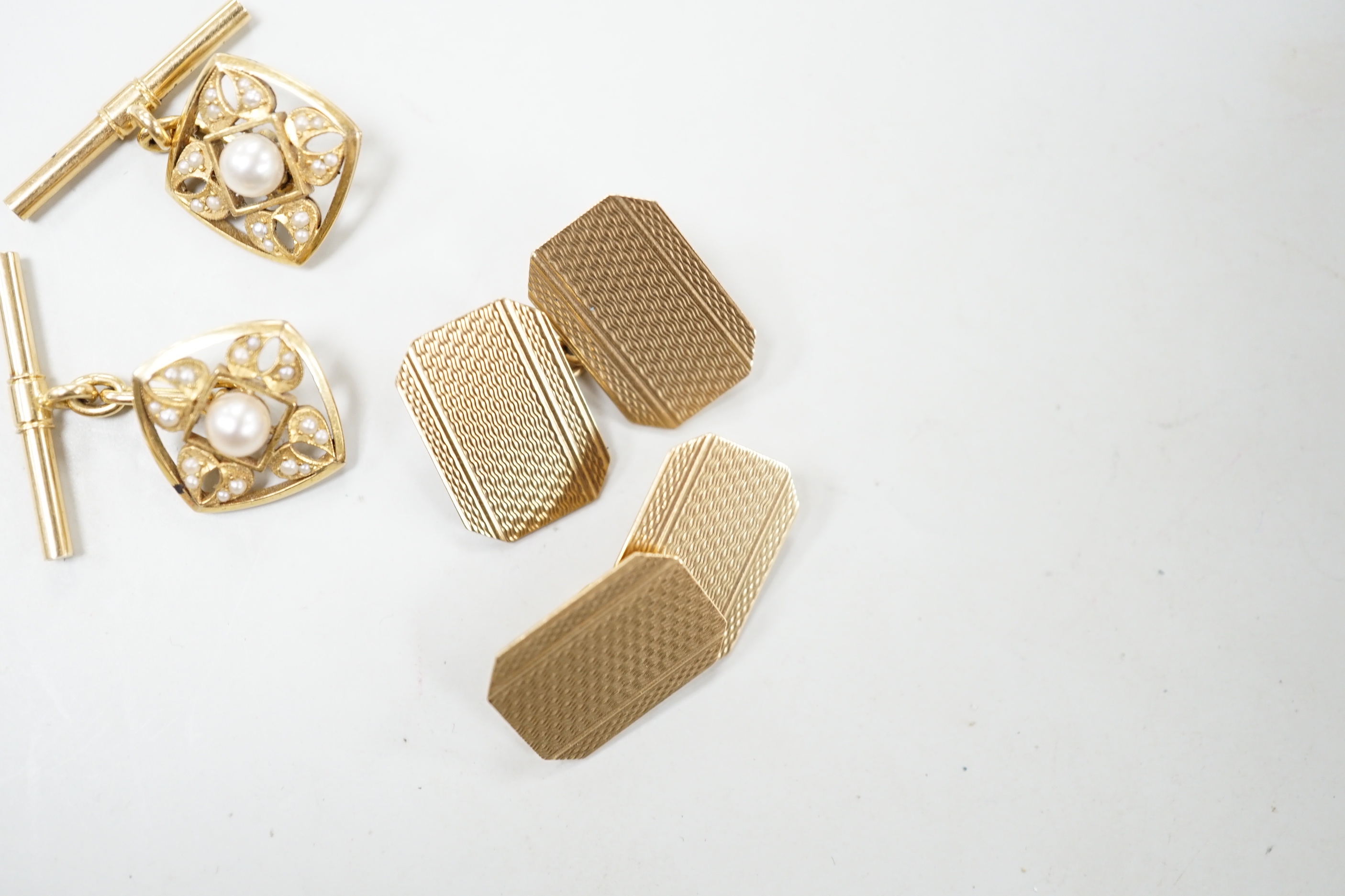 Two pairs of yellow metal cufflinks including engine turned 9ct and cultured pearl set, gross weight 8.9 grams.